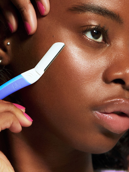 model using waterpark dermaplane on her cheekbone 